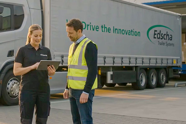 Logistics Center, two people in front of a truck